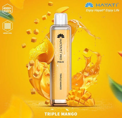 A colorful Hayati  pro max 4000 puffs bottle of Triple Mango flavour next to ripe mangoes,